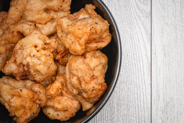 Looking down on a bowl of Lion's mane fried mushroom bites