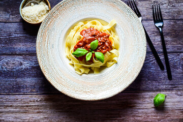  Tagliatelle bolognese Italian home made  food . Fresh home made  tagliatelle egg pasta  with bolognese sauce  ,parmesan cheese ,fresh parsley  and black pepper. Kitchen Poster 