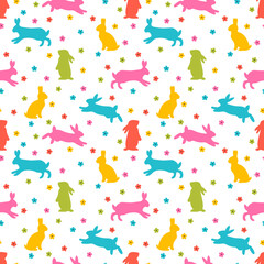 Cute seamless pattern with bunnies and daisies. Easter floral background. Rabbit, hares silhouettes