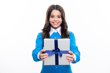 Obraz premium Young teenager girl child holding gift box isolated on white background. Gift for kids birthday.