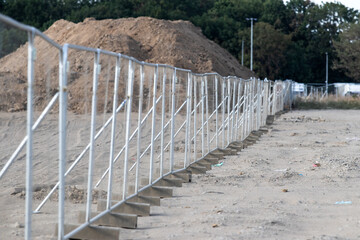 metal fence at the construction of the hall - 552644087