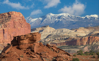 Layered rock formations and snow capped mountains from Panorama Point in Capitol Reef National Park, Utah