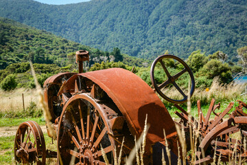 Vintage agricultural tractor deserted and rusting away