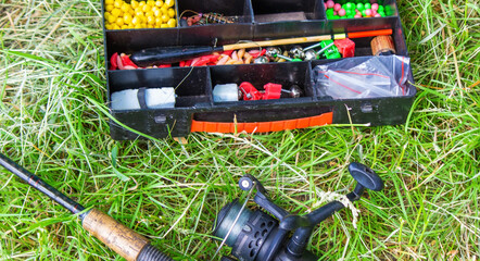 rod and tackle on the grass. Nature.