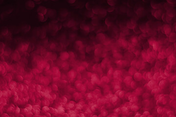 Trendy viva magenta, pink sparkling glitter bokeh background, abstract defocused texture. Holiday...