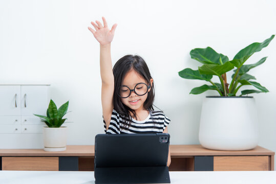 Asian Child Girl Student Wow Excited On Video Call Learning To Studying Online Class Or Person Learn From Home School With Tablet