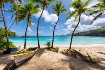 Coco palm trees and a fishing boats in sandy beach on Paradise island. Fashion travel and tropical beach concept.