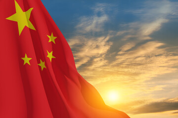Close up waving flag of China on background of sunset sky. Flag symbols of China. National day of...