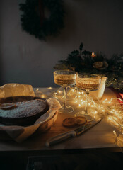 Christmas table with champagne glasses and pie