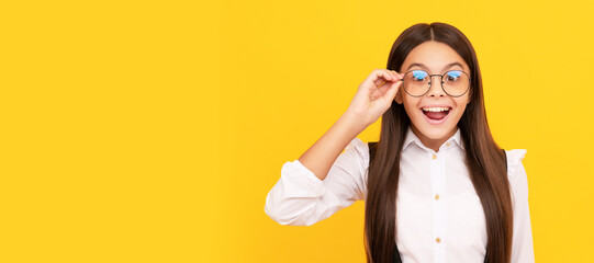 amazed teen girl in school uniform and glasses for vision protection, eyewear. Child face,...