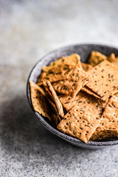 Bowl of flax and sesame seeds chips