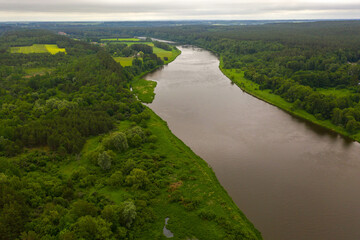 Fototapeta na wymiar Drone photography of river forest near it