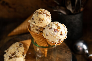 Butter pecan ice cream in waffle cones - obrazy, fototapety, plakaty