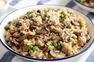Homemade Mushroom Risotto with Peas on a Plate, side view.