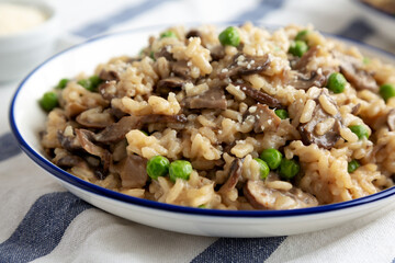 Homemade Mushroom Risotto with Peas on a Plate, side view. Close-up.