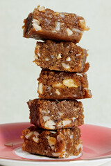 Dodha Burfi dessert with almonds on a plate. Traditional Indian fudge.