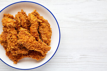 Homemade Chicken Strips with Mustard and BBQ on a Plate, top view. Flat lay, overhead, from above. Space for text.