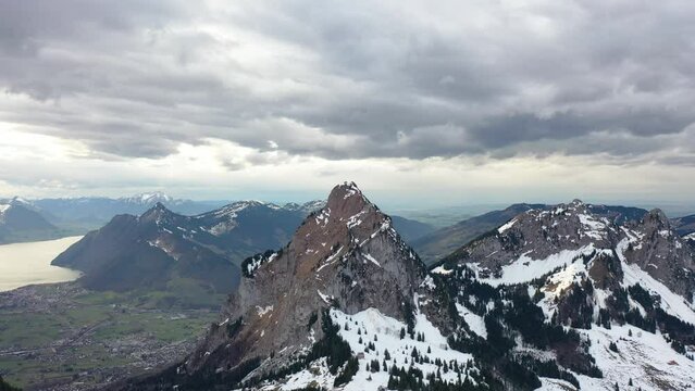 Amazing footage of a beautiful winter wonderland in the alps of Switzerland. Wonderful flight with a drone over a snow-covered landscape in the canton of Schwyz around a mountain called Grosser Mythen