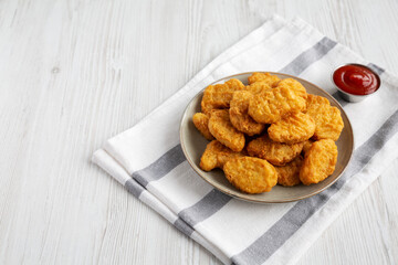 Homemade Chicken Nuggets with Ketchup, side view.