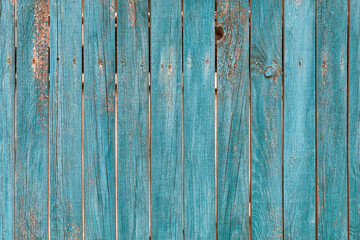 Old wooden fence with faded green paint texture. - 552663237