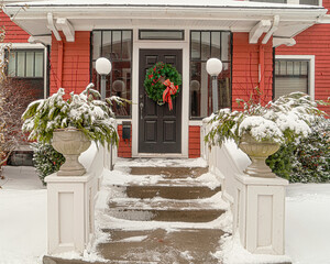 Traditional older home decorated for Christmas. - 552663271