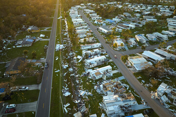 Badly damaged mobile homes after hurricane Ian in Florida residential area. Consequences of natural...