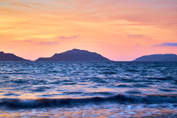 sunset with three islands in the background, waves in first plane in mazatlan sinaloa 