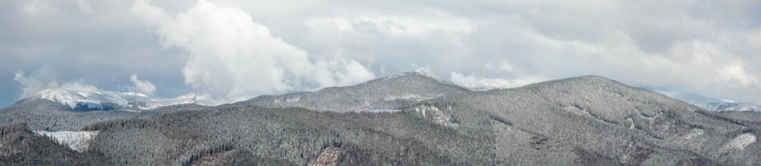 Picturesque winter morning mountains panorama view from Skupova mountain alpine slope. Verkhovyna...