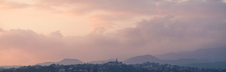 Sicily. At sunset, view of the comune of Trecastagni from the comune of Aci Bonaccorsi. At the centre, the tower of the Church of Saint Nicholas of Bari.