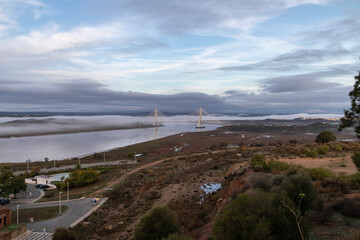 Obraz premium Guadiana International Bridge in Ayamonte, Spain. It is one of the longest bridges in Spain and the third longest bridge in Portugal after the Vasco de Gama bridge and the 25 de Abril bridge, Lisbon.