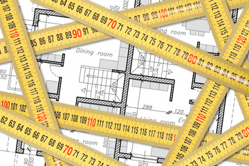 Measurement and survey of a residential building - concept with yellow metal ruler