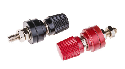 Red and black binding post connector with screw threaded terminal isolated on a white background. Close-up of electrical fasteners for bare wire clamping on electronic test equipment or other devices.