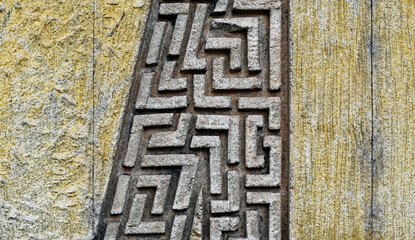 Abstract texture on yellow wall