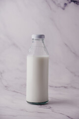 Close-Up Of Milk Bottle On Table 