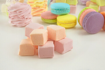 Various of sweetness: macaroons, marshmallows and zephyrs. Homemade colored desserts for the holiday.