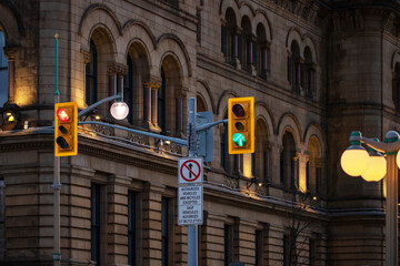Traffic lights against historical building in downtown Ottawa, Canada at night
