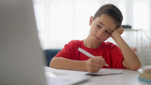 Upset boy having no motivation to do homework, difficult math problem, trouble