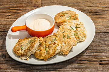 Hake fillet fried in batter. Sauce, fresh rosemary. Vegetarian healthy food concept