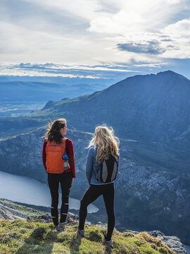 Two women exploring the mountains and wilderness of the Yukon. Feeling alive and vibrant in the beautiful scenery around Haines Junction; Yukon, Canada