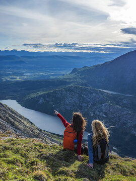 Two women exploring the mountains and wilderness of the Yukon. Feeling alive and vibrant in the beautiful scenery around Haines Junction; Yukon, Canada
