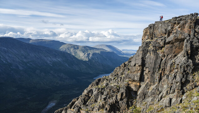 Two women exploring the mountains and wilderness of the Yukon. Feeling alive and vibrant in the beautiful scenery around Haines Junction; Yukon, Canada