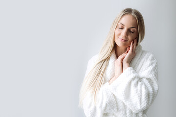 Woman in bathrobe who represents aesthetic medicine and natural beauty concepts