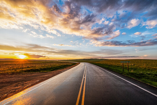 Winding country road at sunset; Val Marie, Saskatchewan, Canada