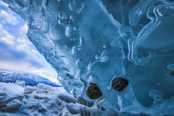 Crushed ice takes on beautiful patterns and shapes along the shoreline of Kluane National Park; Yukon, Canada