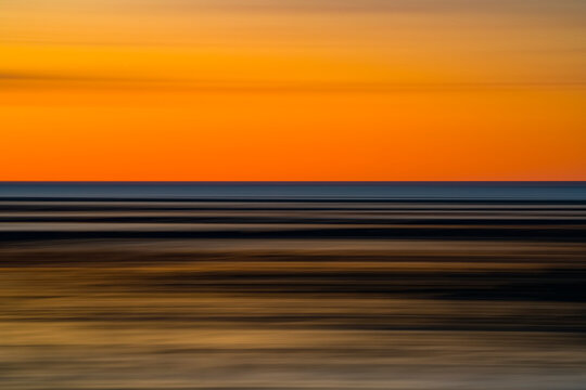 Impressionistic image of the shoreline of Hudson Bay. Taken by panning with a slow shutter speed along the horizon line; Churchill, Manitoba, Canada