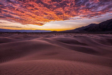 Sunset over sand dunes in California, Death Valley National Park; California, United States of America