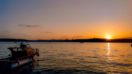 Naklejka na ściany i meble sunset on the sea with ship
