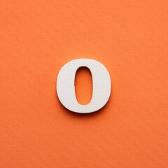 Alphabet letter O - White wooden letter on pink background