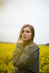 Fototapeta premium Cheerful girl in the field in summer