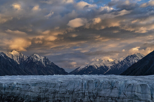 The Donjek glacier in Kluane National Park. Sunset lights up the clouds creating a stunning image.